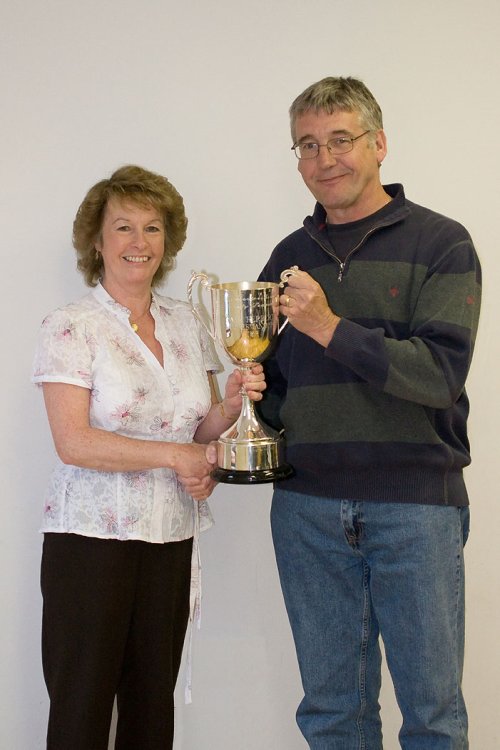 Wotton Rovers secretary Steve Tasker receiving the Dave Herbert Sportsmanship Cup from Gill Herbert