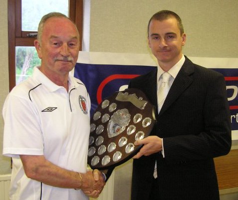 Mark Russell receives the Tony Neather Shield from Ken Fry.
