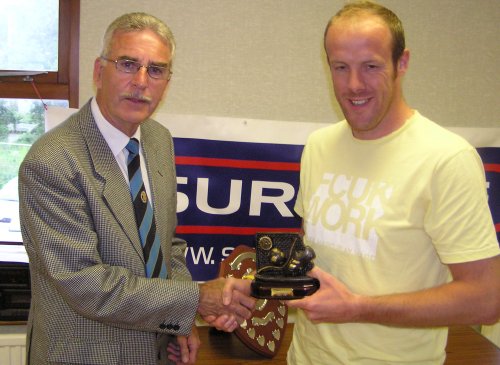 Nathan Baird receives the Leading Goalscorer Trophy from Robin Stewart.