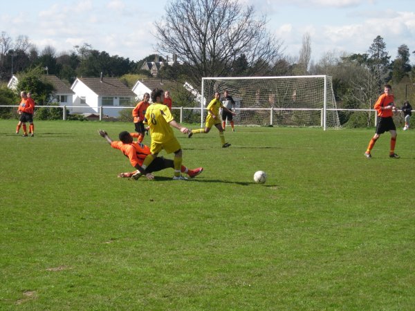 Ken Malala gets a tackle in for Henbury