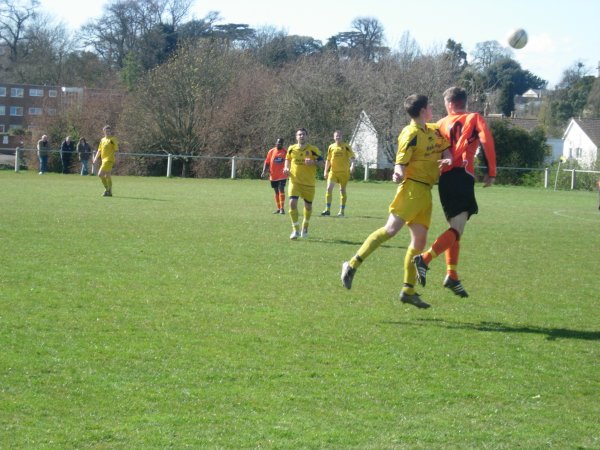 Davies and Bamford challenge for the ball